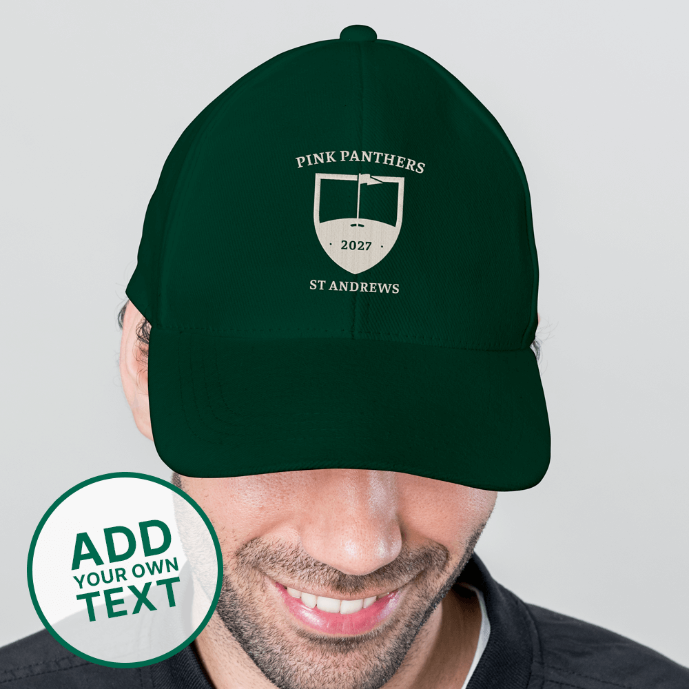 A male model wearing a green custom golf cap with a tour crest design that has been personalised with Pink Panthers, 2027, St Andrews 