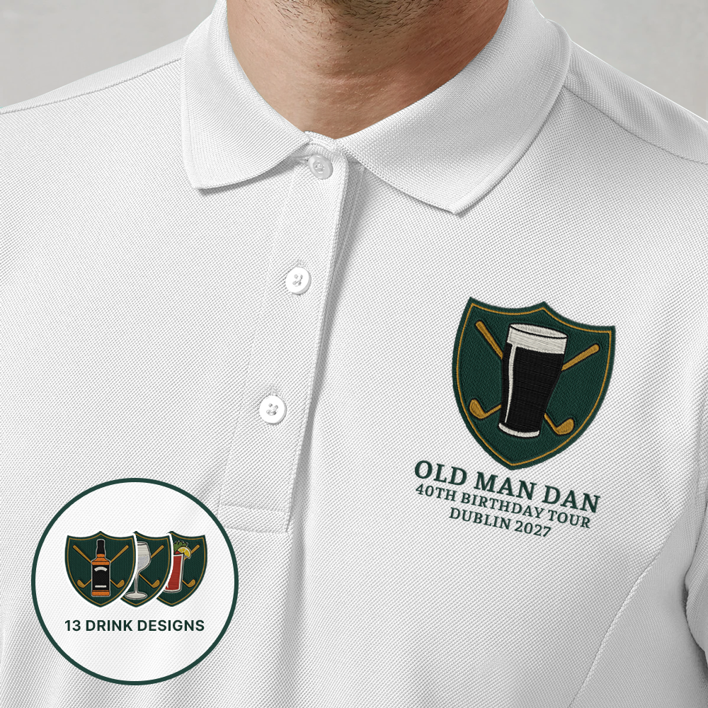A male model wearing a blue golfing shirt with an embroidered crest that has a pint of Guinness in front of golf clubs that cross over each other in an X shape with custom text reading Old Man Dan, 40th Birthday Tour, Dublin 2027