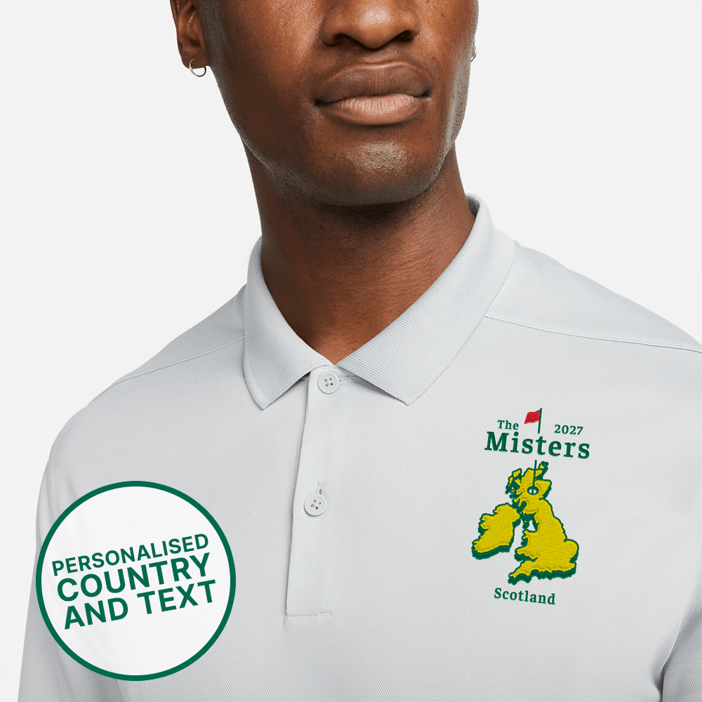 A male model wearing a custom golf polo which is Masters-inspired where you can change the country on the logo and also put the date and a custom line of text 