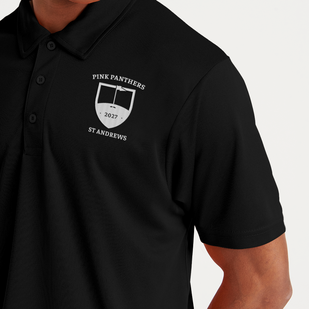 A male model wearing a custom golf polo with a tour crest design that has been personalised with Pink Panthers, 2027, St Andrews