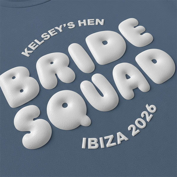 A blue hen do t shirt with custom white 'puff print' bubble writing that reads Kelsey's Hen, Bride Squad, Ibiza 2026