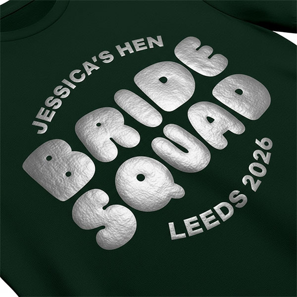 A black hen do t shirt with custom metallic silver 'puff print' bubble writing that reads Jessica's Hen, Bride Squad, Leeds 2026