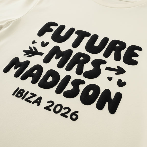 A white hen do shirt with custom metallic black 'puff print' bubble writing that reads Future Mrs Madison, Ibiza 2026