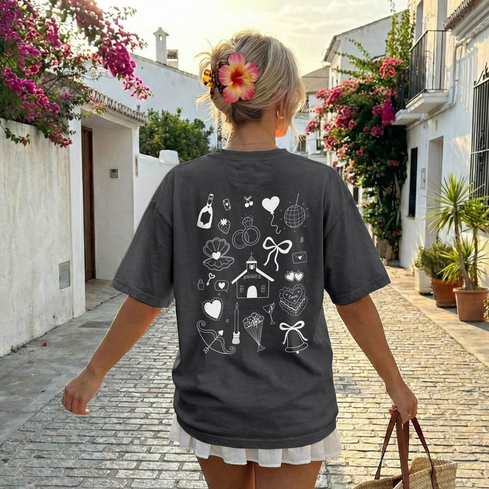 The back of a custom hen do t-shirt that has a white doodle design with chapel-themed drawings such as a chapel, a wedding cake, a disco ball, a wedding bell and more