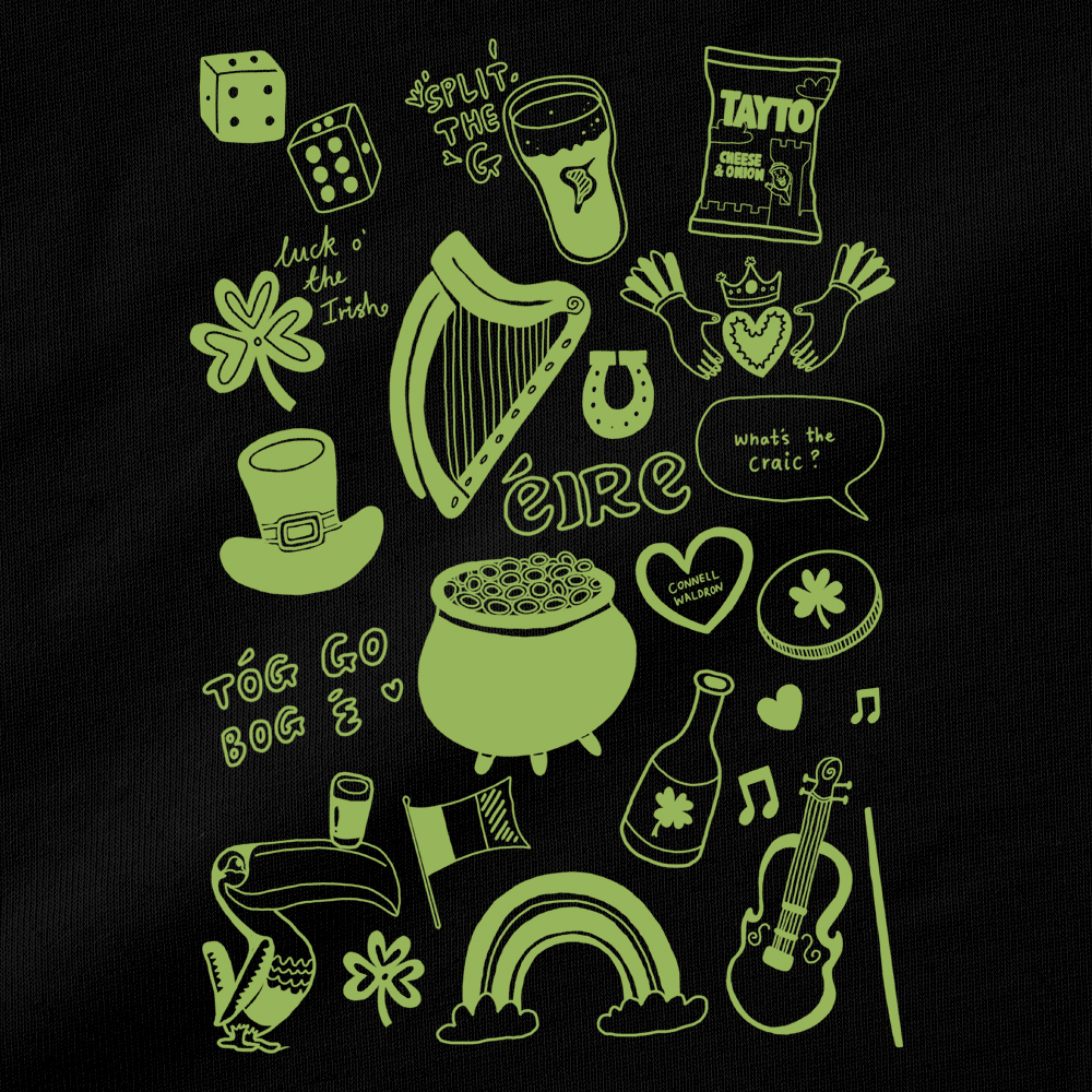 A close up of a St Paddy's themed hen do shirt that has various St Patrick themed doodles including a clover, a pot of gold, the Guinness harp and more 