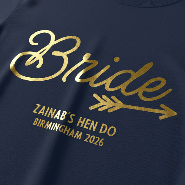 A black hen do shirt with custom shiny gold foil text that reads Bride, Zainab's Hen Do, Birmingham 2026