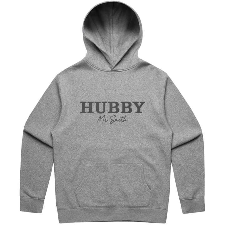 A luxe honeymoon hoodie that is embroidered with HUBBY in statement font and Mr Smith in a cursive font 