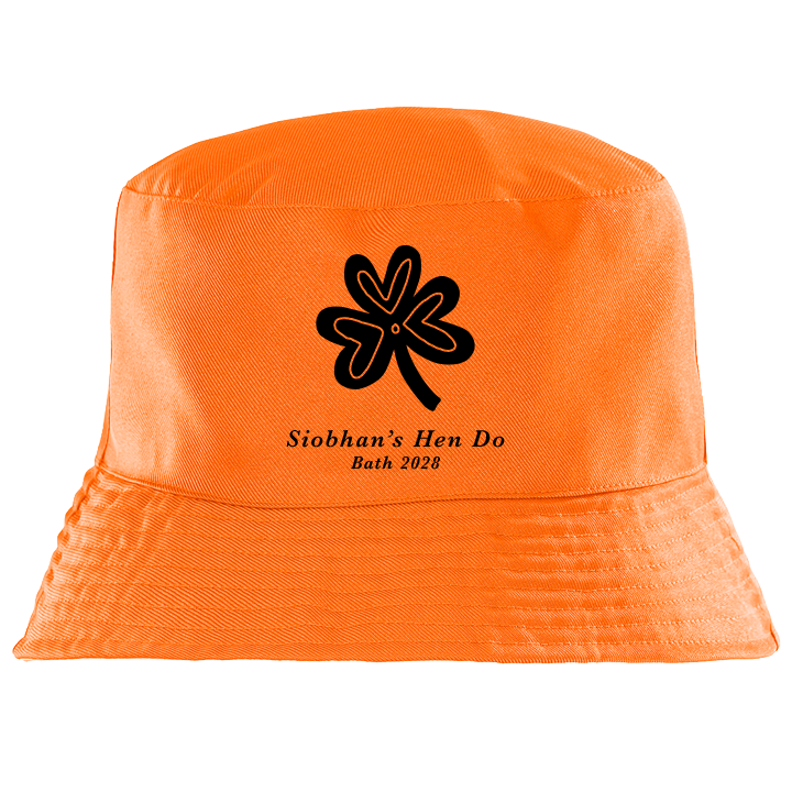 A custom St Paddy's themed hen bucket hat in orange with a shamrock design in black with the custom text Siobhan's Hen Do Bath 2028