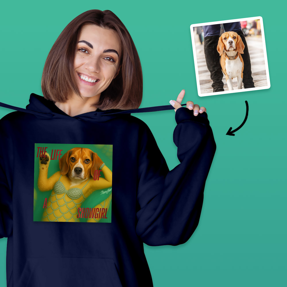 A female model wearing aTaylor Swift inspired hoodie that can have a photo of your pet added to it so it looks like they are a part of the Life of a Showgirl album, which has a dog on it with the text the life of a showgirl