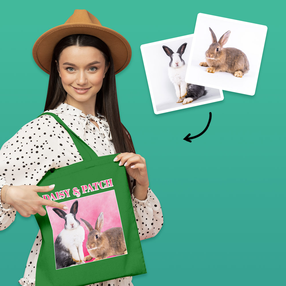 A female model wearing a custom pet tote bag with a bootleg-style design that has two different rabbits on it with custom text reading Daisy & Patch