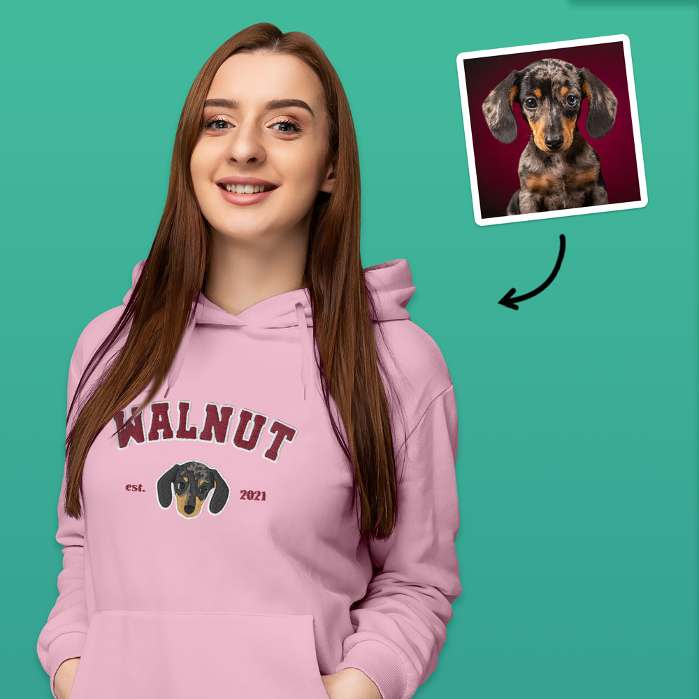 A custom pet hoodie in a varsity style which has been customised with an embroidered beagle and custom text reading Walnut est 2021