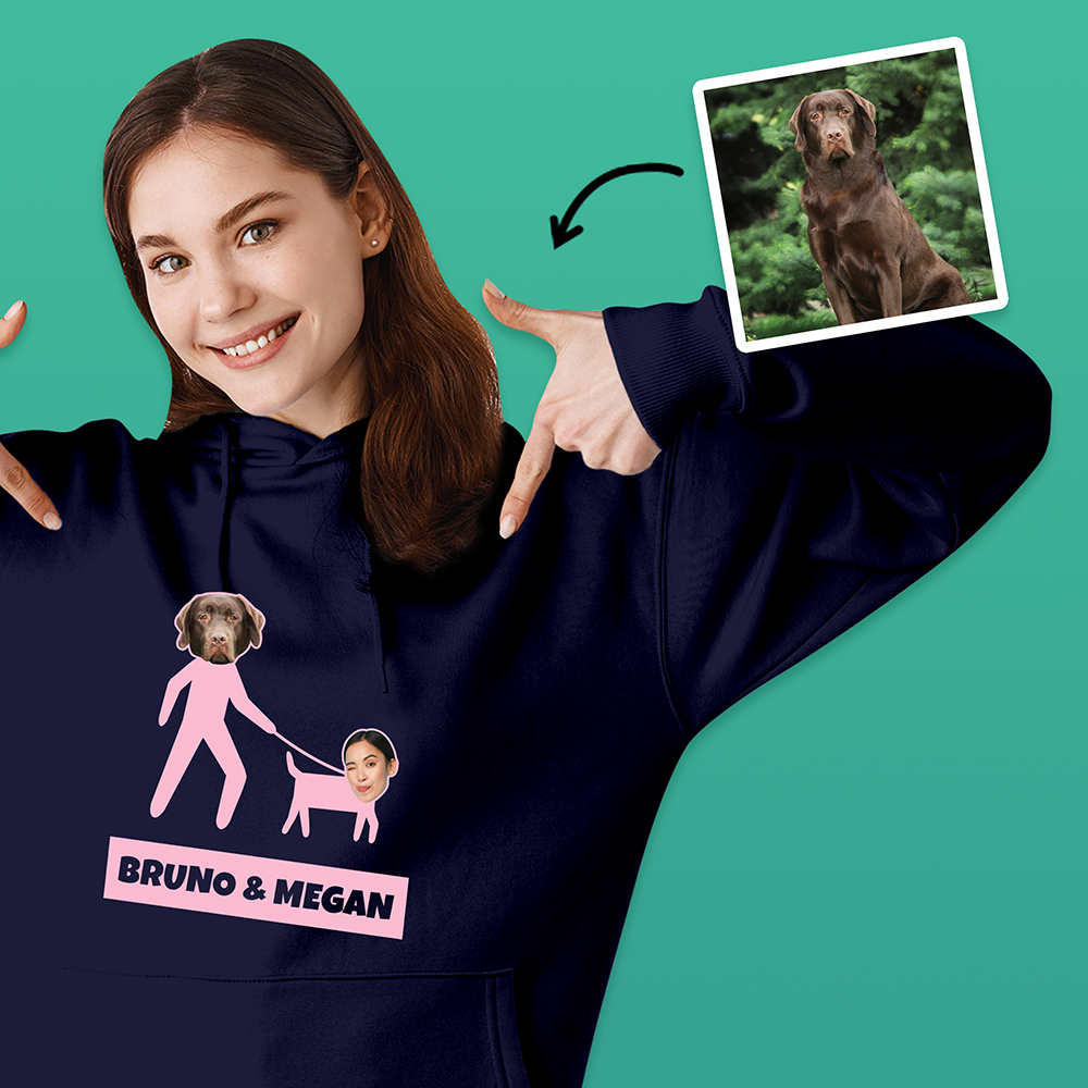 A blue hoodie that can be customised with the face of a pet and its owner, this one makes it look like the dog is walking its owner with custom text reading Bruno & Megan