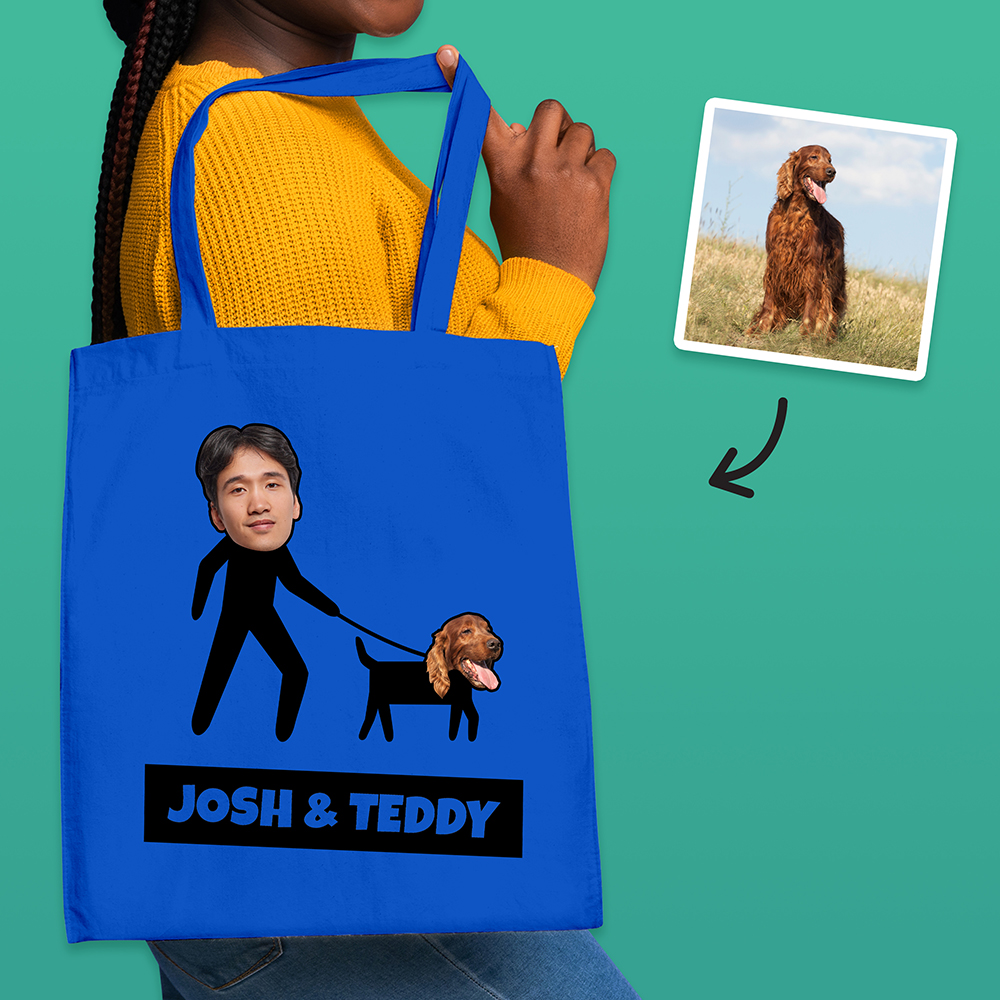 A blue tote bag that can be customised with the face of a pet and its owner, this one makes it look like the owner is walking the dog with custom text reading Josh & Teddy