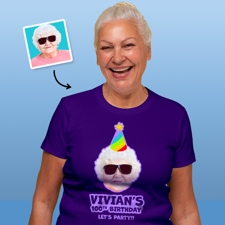 A female model wearing a custom 100th birthday shirt where you can add a person's picture so it looks like they're wearing a rainbow coloured party hat, as well as custom text 