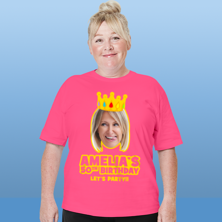 A female model wearing a custom 50th birthday shirt where you can add a person's picture so it looks like they're wearing a crown, as well as custom text 