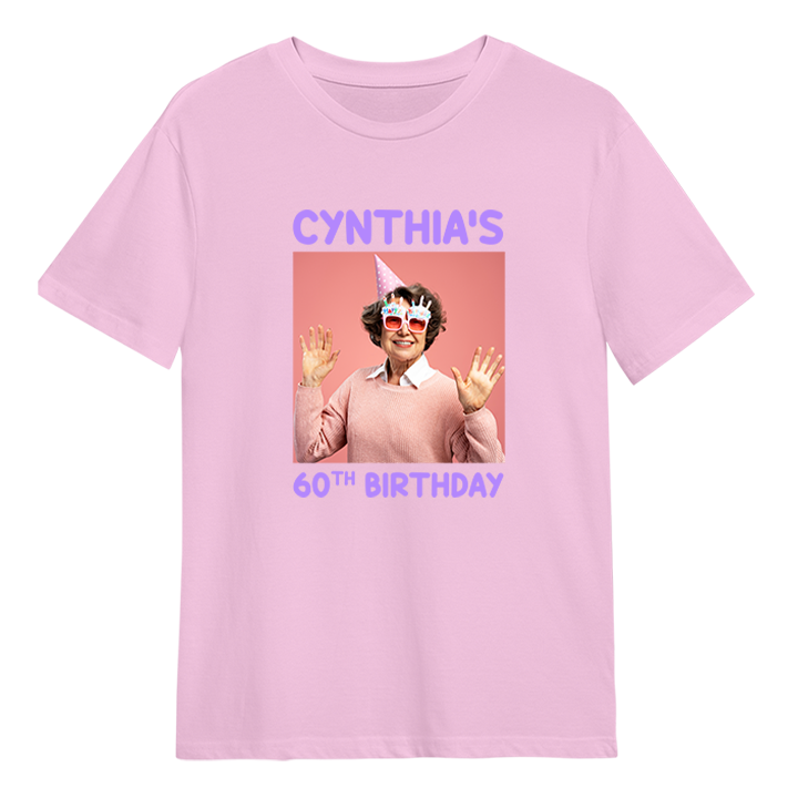 A custom birthday shirt that has had a photograph of a woman in a party hat and glasses added to it with the custom text Cynthia's 60th Birthday