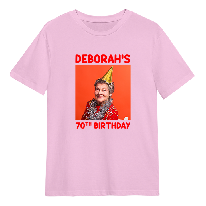 A custom birthday shirt that has had a photograph of a woman in a party hat added to it with the custom text Deborah's 70th birthday