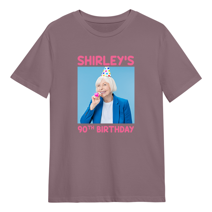 A custom birthday shirt that has had a photograph of a woman in a party hat added to it with the custom text Shirley's 90th birthday