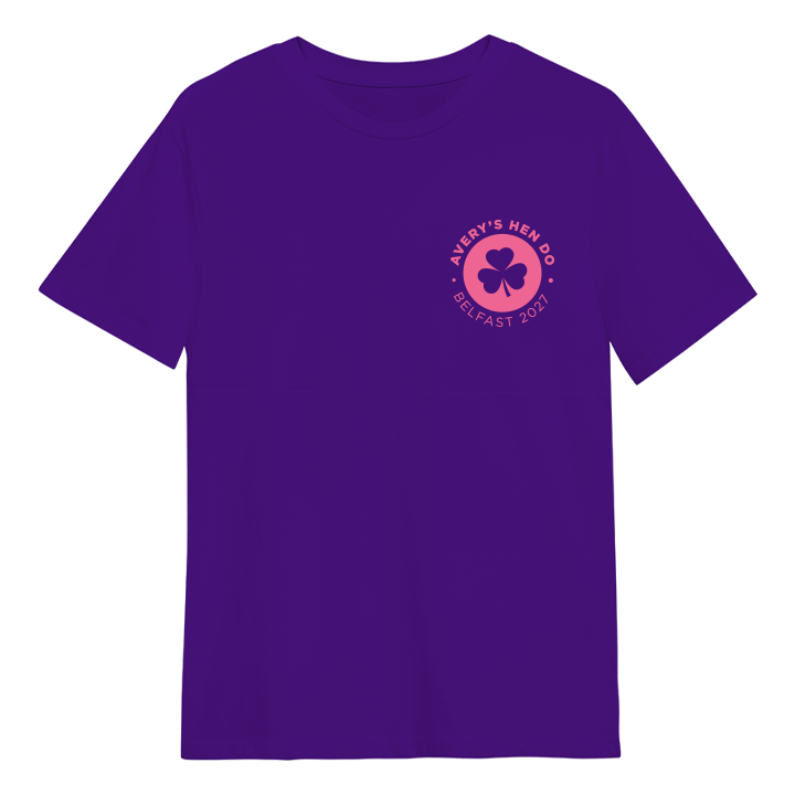 A custom hen do t shirt that has a subtle emblem in the top right hand corner of a shamrock with the custom text Avery's Hen Do Belfast 2027 around it