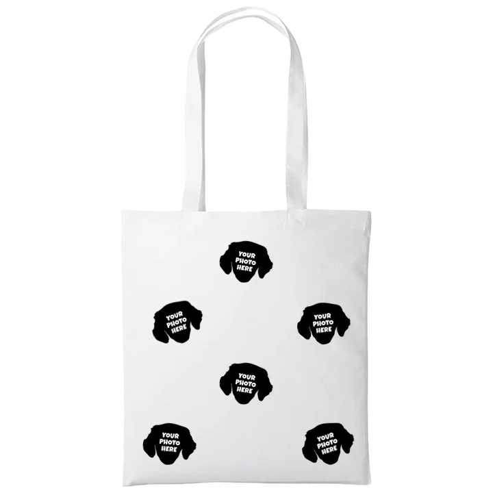 A custom pet tote bag that has space for multiple faces of your pet all over the bag 
