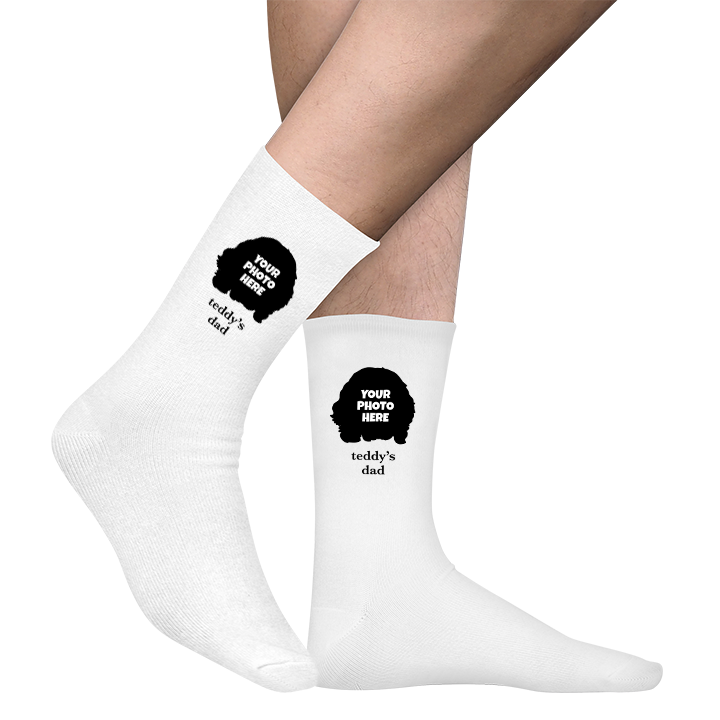 A pair of white socks that can be customised with the face of a pet and up to two lines of custom text 