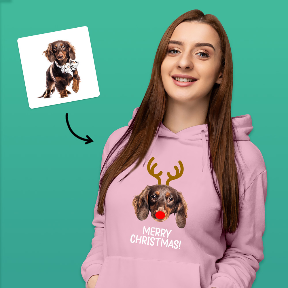 A custom pet hoodie that has been personalised with a dog's face wearing antlers and a red nose like Rudolph alongside custom text reading Merry Christmas