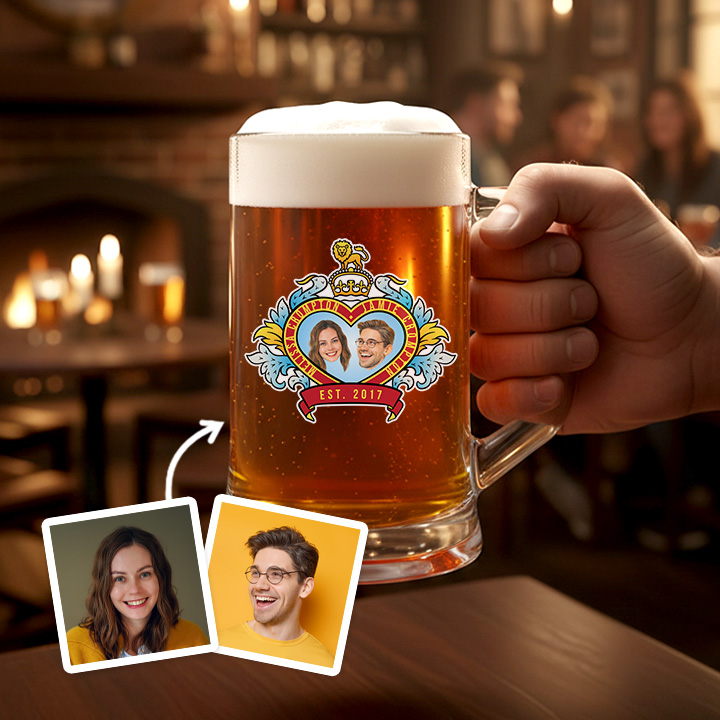 A custom stein boasting a Royal Wedding style love heart design which has been personalised with a picture of a couple alongside their names and date they got married/together reading est 2017 with a pub background