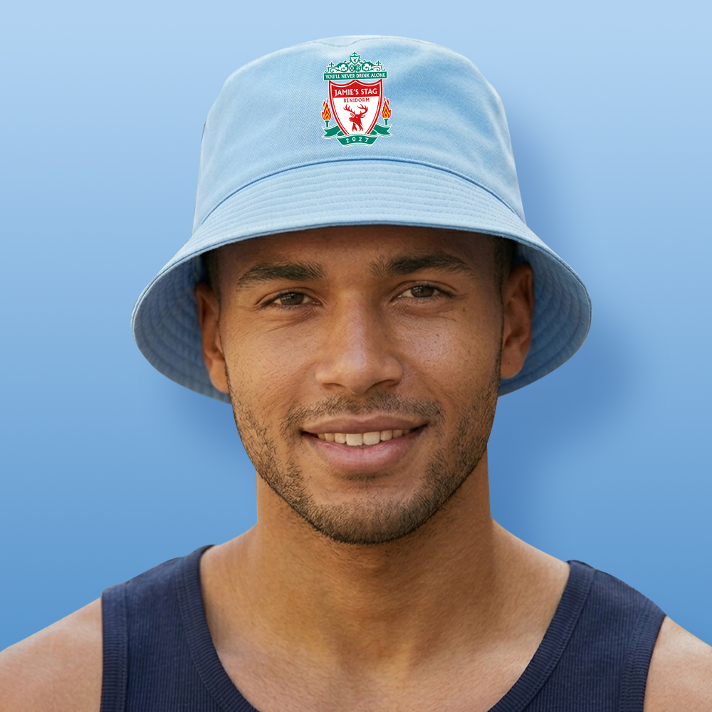 A male model wearing a blue custom stag do Liverpool F.C themed bucket hat with the Liverpool F.C logo edited to look like a stag with the text You'll never drink alone Jamie's Stag Benidorm 2027