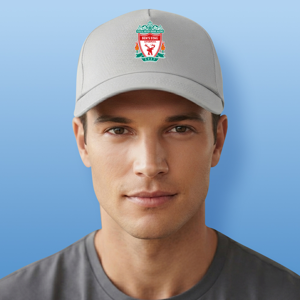 A male model wearing a grey custom stag do Liverpool F.C themed cap with the Liverpool F.C logo edited to look like a stag with the text You'll never drink alone Ben's Stag Liverpool 2027