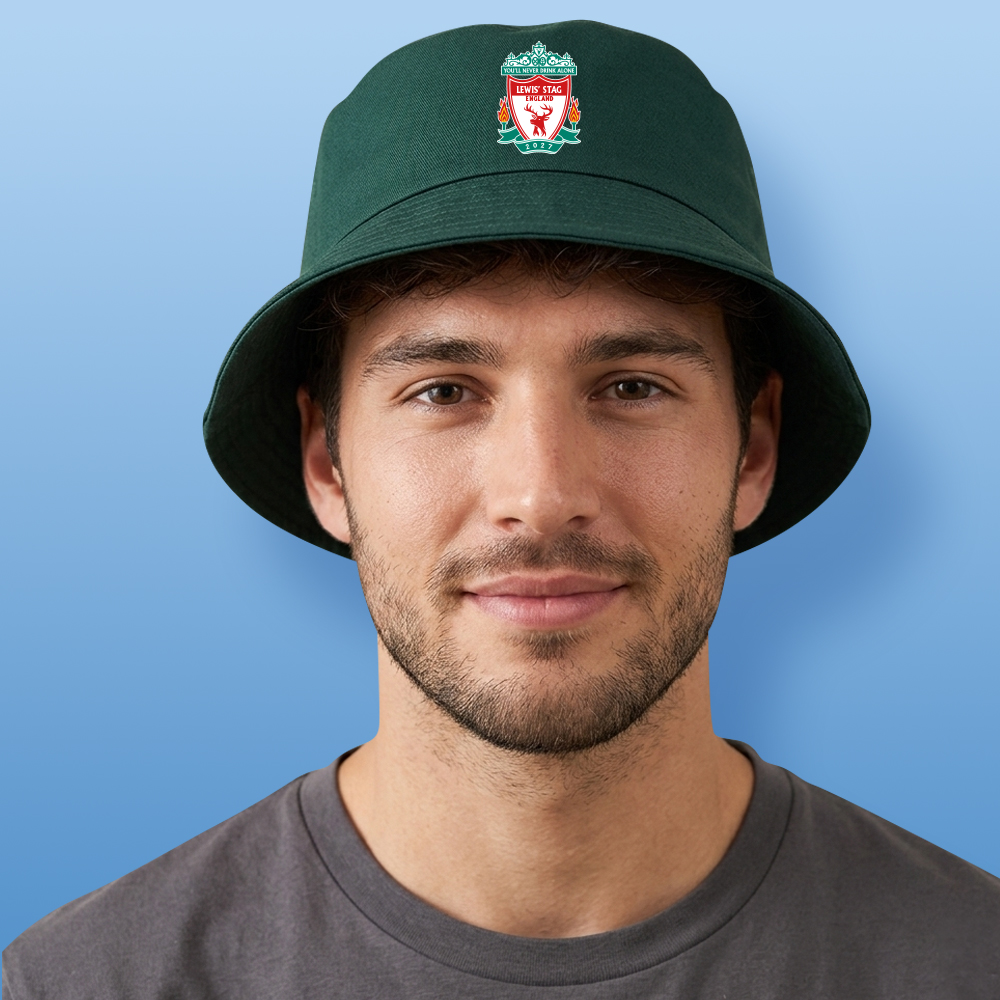 A male model wearing a green custom stag do Liverpool F.C themed bucket hat with the Liverpool F.C logo edited to look like a stag with the text You'll never drink alone Lewis' Stag England 2027