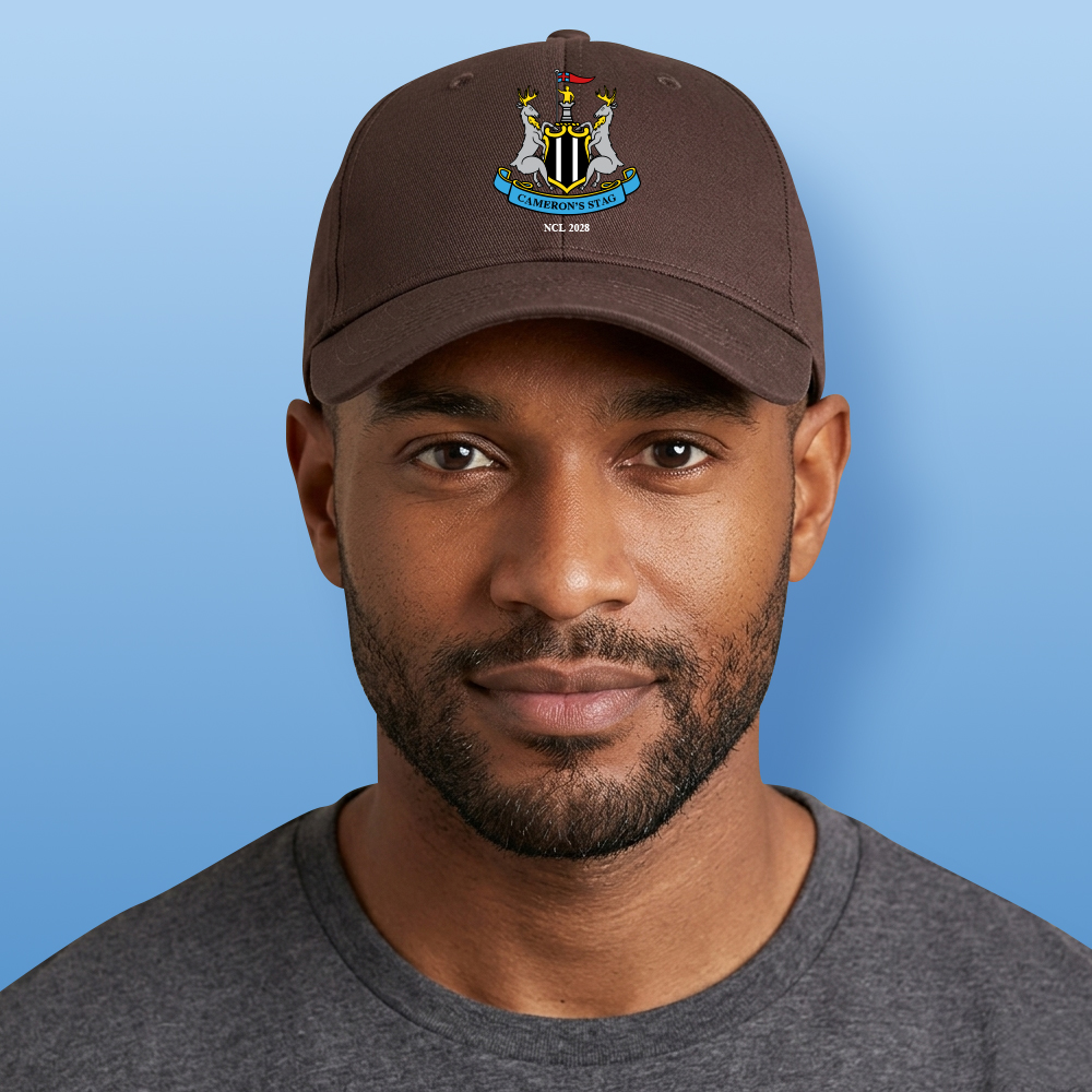 A male model wearing a brown custom Newcastle United stag-themed cap which has the Newcastle United logo with two stags and custom text reading Cameron's Stag NCL 2028