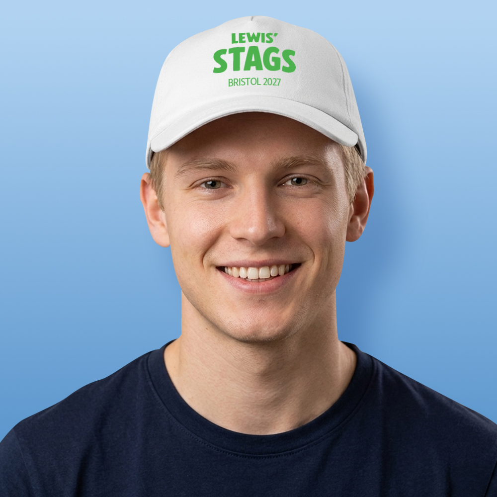 A male model wearing a white custom stag do cap with the custom text Lewis' Stags Bristol 2027 in a green bold font
