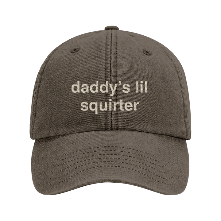 A rude premium vintage cap in brown that has been embroidered with daddy's lil squirter in tusk coloured thread 