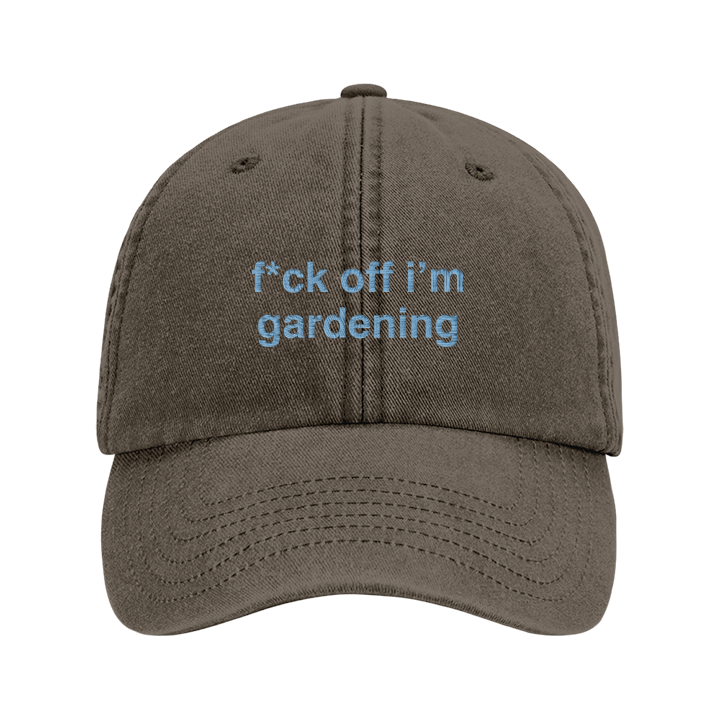 A premium vintage embroidered cap in vintage brown reading f*ck off i'm gardening in blue custom text 
