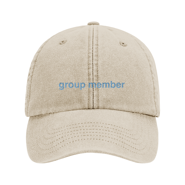 A premium custom stag do cap in khaki that has been embroidered with group member in blue text 