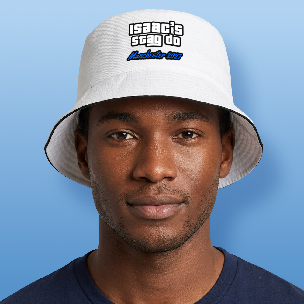 A male model wearing a white custom GTA themed stag do bucket hat that has custom text in the style of the GTA logo reading isaac's stag do Manchester 2027