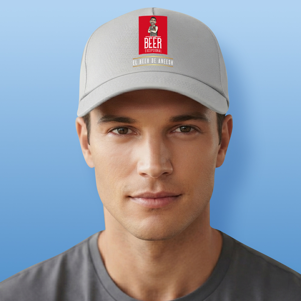 A male model wearing a grey custom Madri-themed cap which has been personalised with a photo of a man's face integrated into the Madri man logo with custom text reading El Beer De Aneesh
