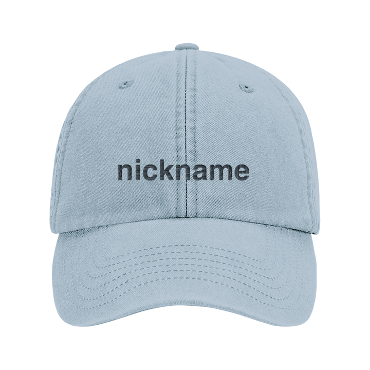 A custom text premium vintage cap in blue that has been embroidered with 'nickname' to show that the text is editable 