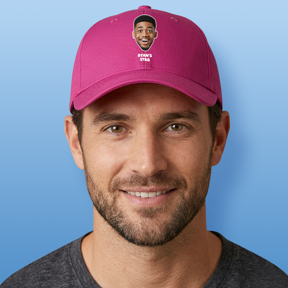 A male model wearing a custom pink cap that has been personalised with a man's face and custom text reading Ryan's Stag