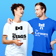 Two men wearing custom t-shirts, one t-shirt reads The Stags and the other t-shirt reads The Groom