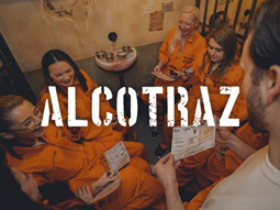 Two people talking and laughing at Alcotraz the Immersive Cocktail Experience