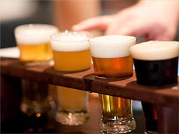 Four sample beers in a small sampling tray