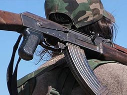 A close up of someone carrying a gun