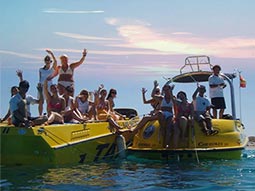 A group of people on speedboats