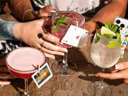 Three different cocktails sitting on a table 