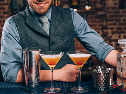A bartender making cocktails