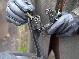 A silhouette of a woman holding a gun to the air