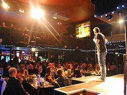 Man on the stage performing stand up comedy