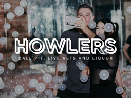 Two partygoers taking a selfie in the ballpit at Howlers Newcastle.