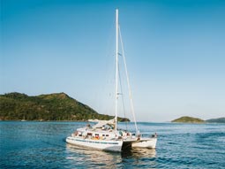 A cruise riding out into the sunset in Valencia on the Sunset Catamaran Cruise tour with Stag Hen Spain